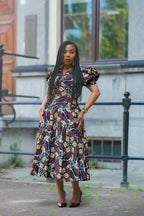 Model wearing Amara Mocha African Ankara print Midi dress by Heritage Clothings