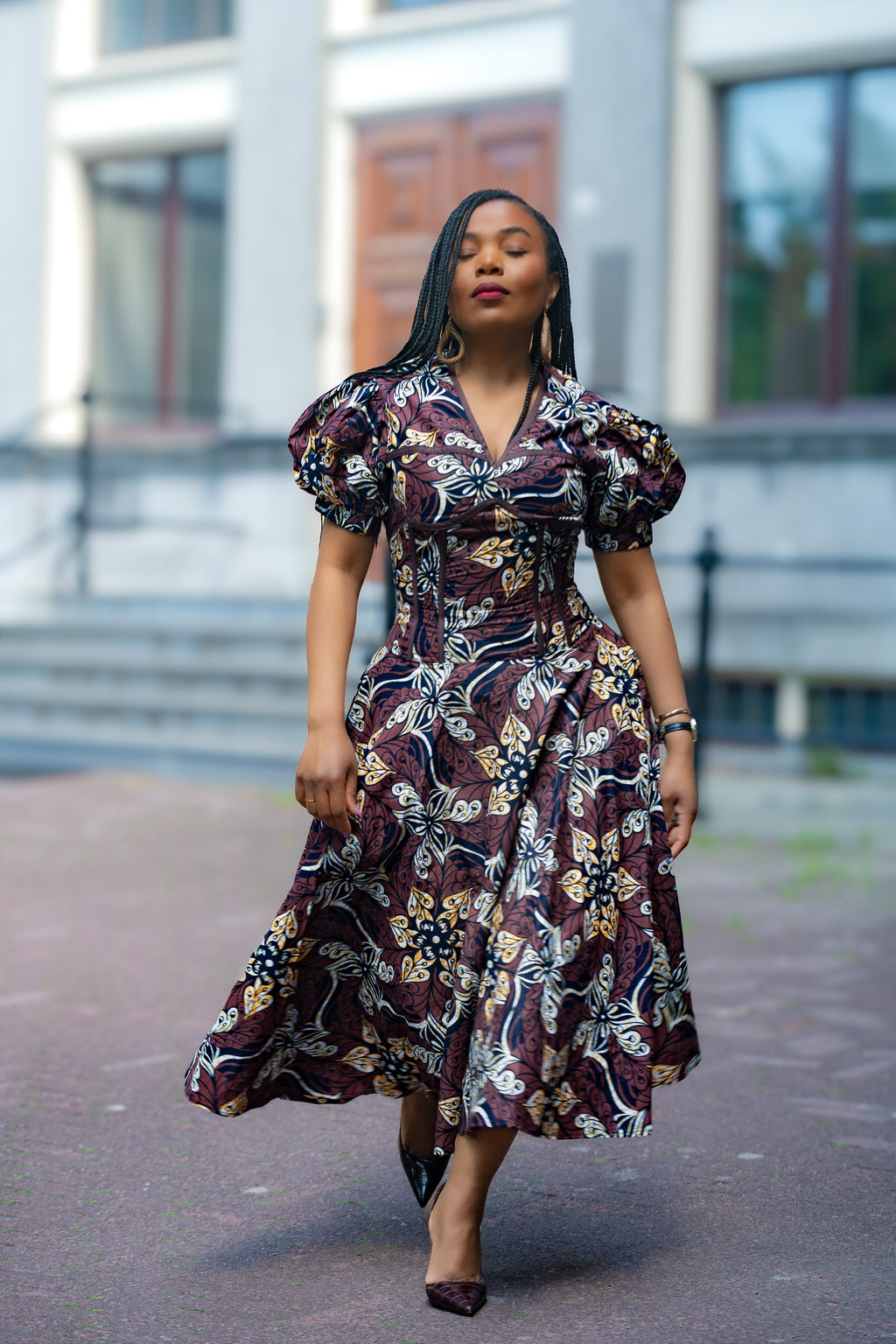 Model wearing Amara Mocha African Ankara print Midi dress by Heritage Clothings