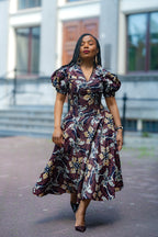 Model wearing Amara Mocha African Ankara print Midi dress by Heritage Clothings