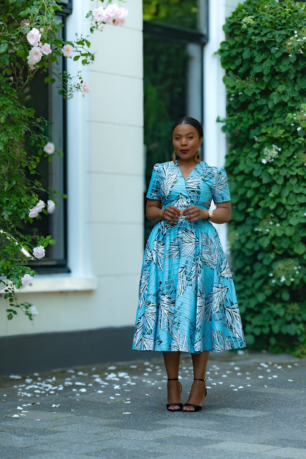Model wearing Azura Aqua and Ivory Gold  African print Ankara Midi Dress by Heritage Clothings