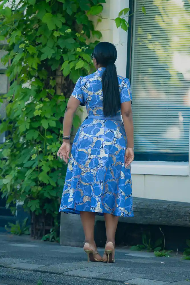 Back view of a Woman's African print Midi dress