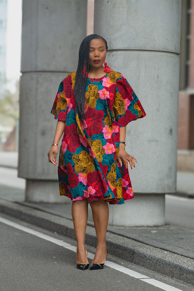 Model wearing a Floral African print Ankara Midi Dress by Heritage Clothings