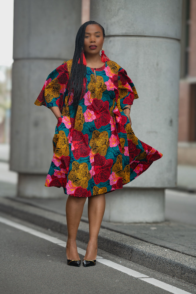 Model wearing a Floral African print Ankara Midi Dress by Heritage Clothings
