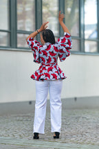 Back view of African print cotton peplum top in Red
