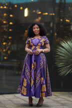 Front view of African print Ankara maxi dress in purple