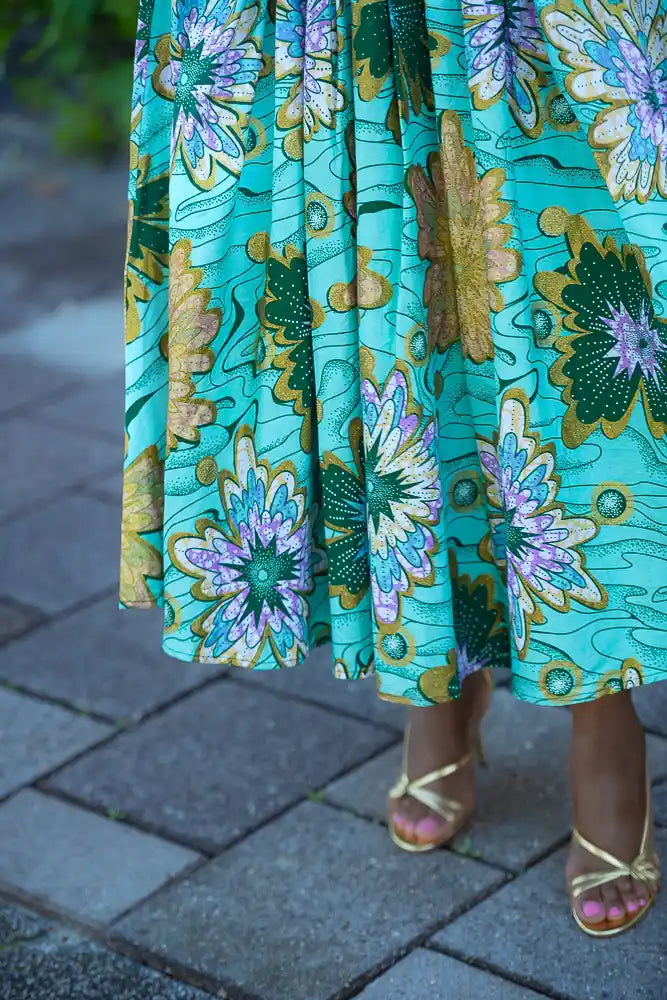 Close up of colorful African wax print dress