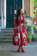 A model wearing a 100% Cotton African floral print Women's fashion outfit in Red & Silver by Heritage Clothings