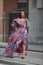 Model wearing an African print pink floral Maxi Set by Heritage Cothings