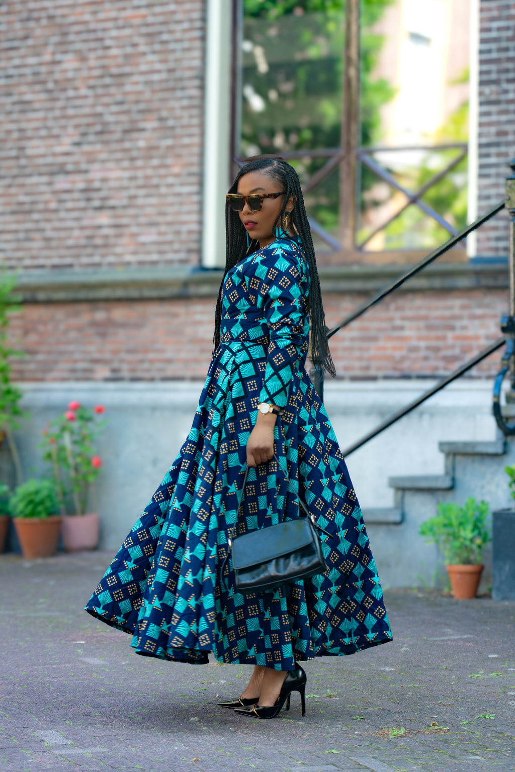 Side view of Blue and Brown African print Cotton Midaxi dress with Long Sleeves & A line Silhouette