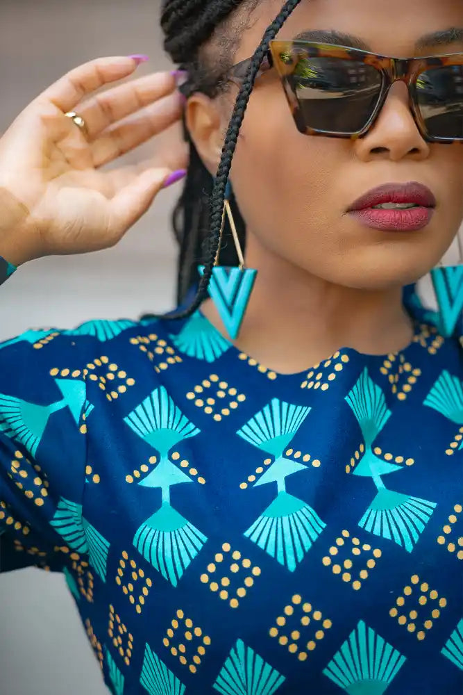 Moyo Blue drop earrings with a Geometric design styled by Model.