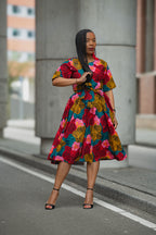 Model wearing a floral African print Ankara Midi Dress