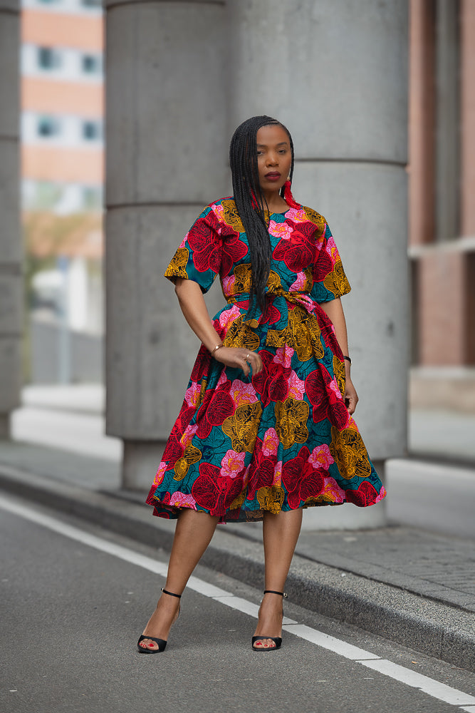Model wearing a floral African print Ankara Midi Dress
