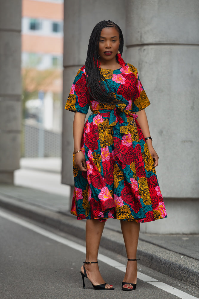 Model wearing a floral African print Ankara Midi Dress