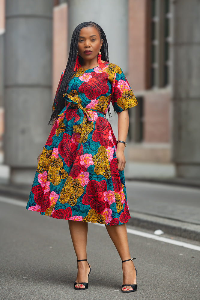 Model wearing a floral African print Ankara Midi Dress