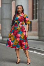 Model wearing a floral African print Ankara Midi Dress