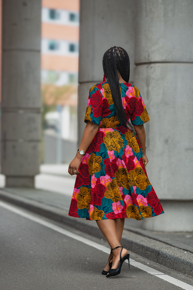 Model wearing a floral African print Ankara Midi Dress