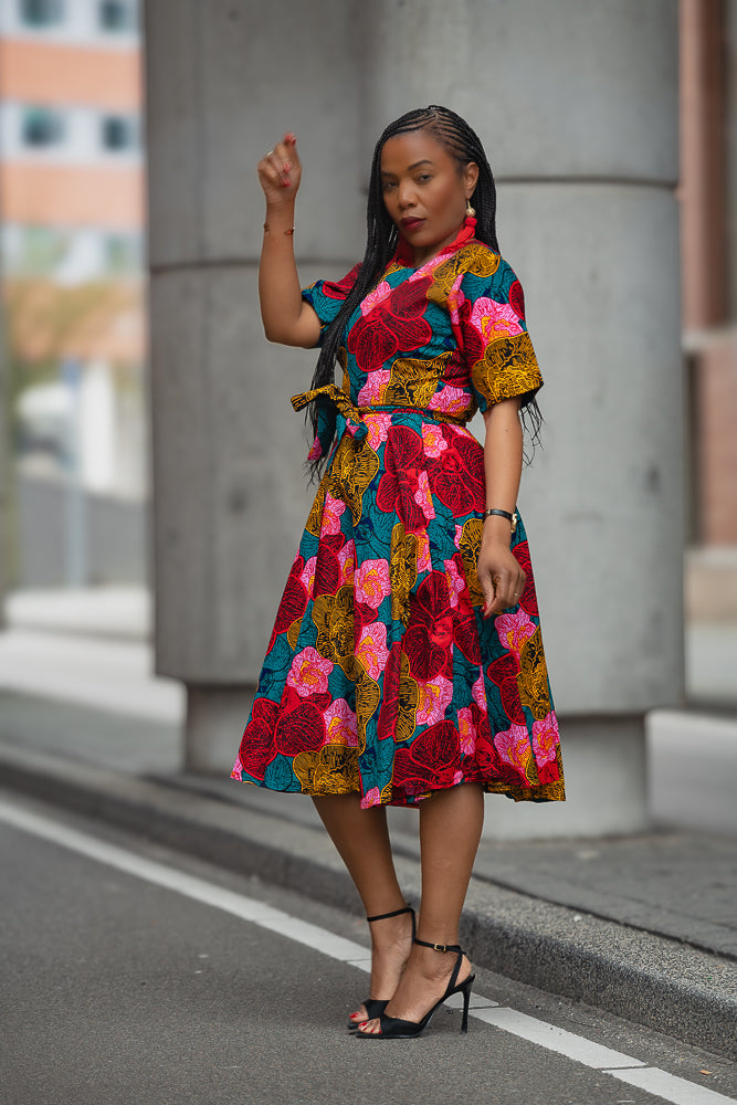 Model wearing a floral African print Ankara Midi Dress