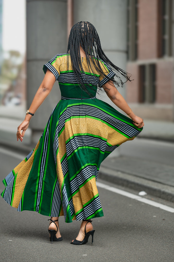 Back View of Women’s Ankara party dress with striped African print.