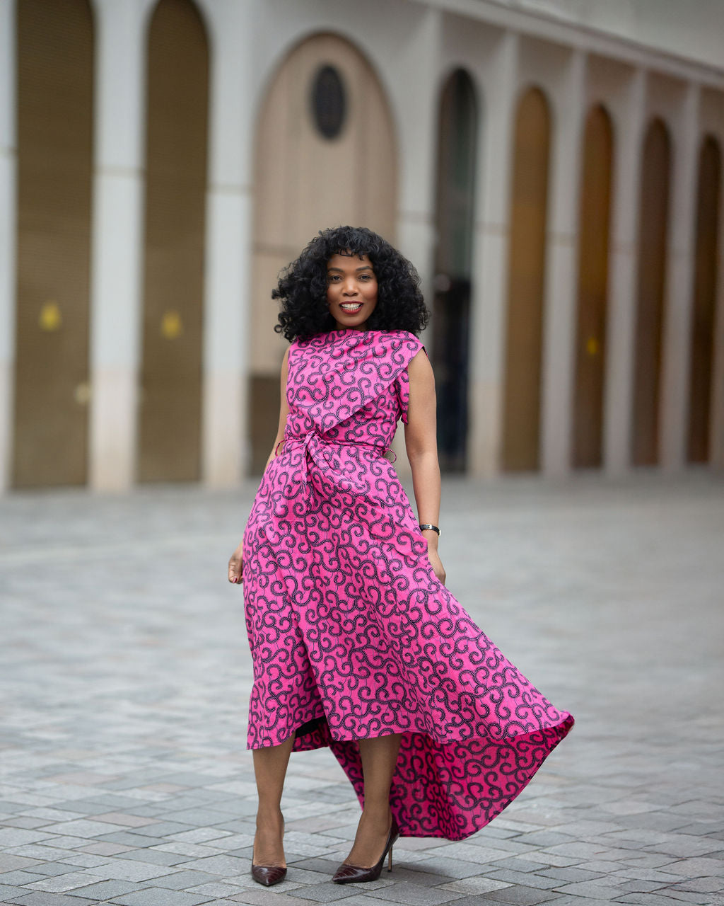 Hi low Ankara midi dress styled for an occasion 