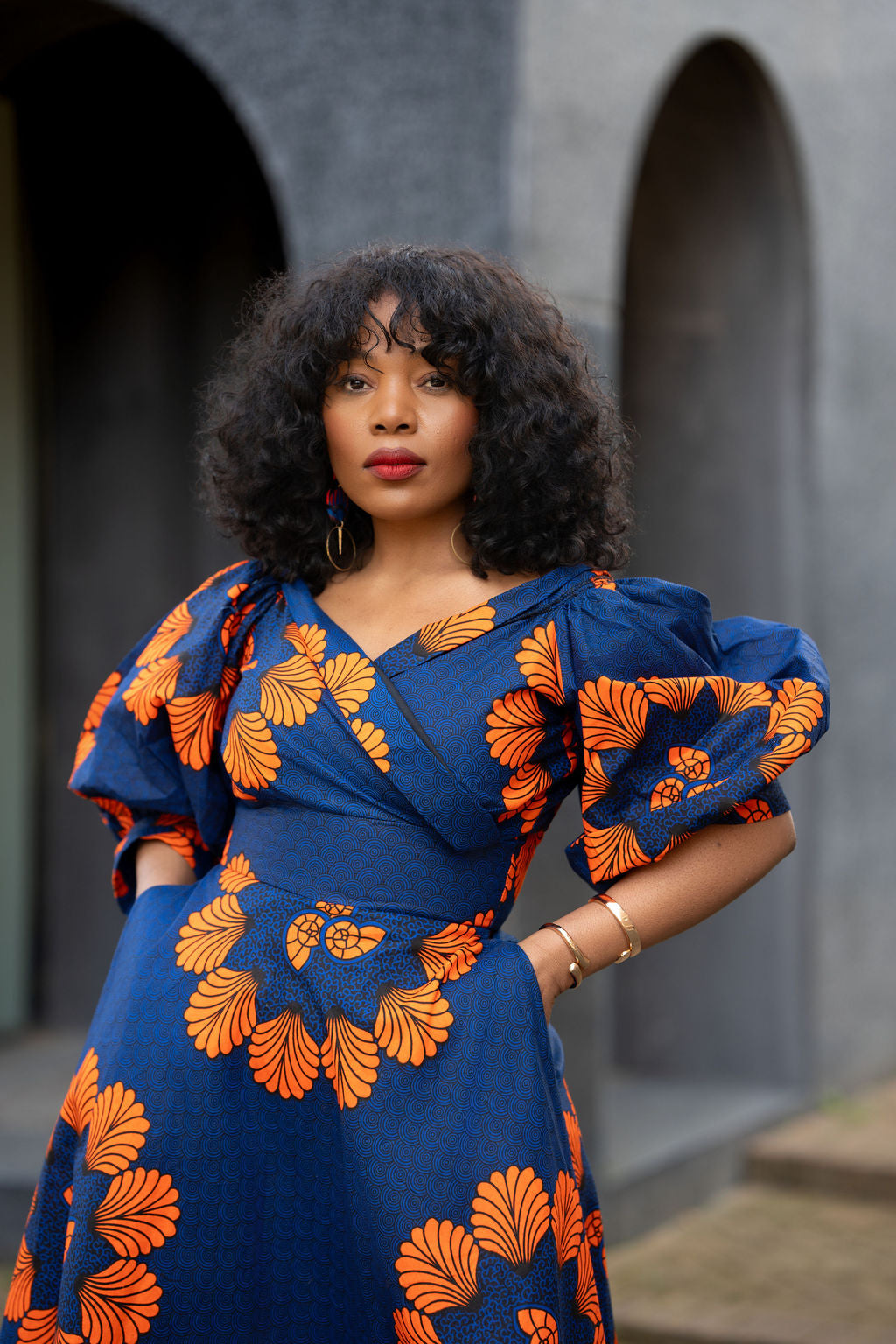 Close up of blue & orange African print Ankara Maxi dress