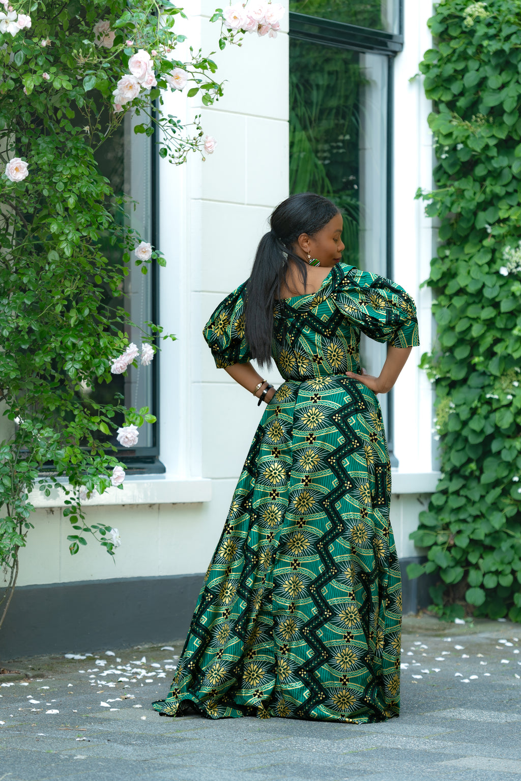 Back view of Green and Gold African print Cotton Maxi Dress with puff sleeves.
