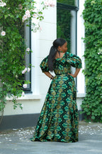 Back view of Green and Gold African print Cotton Maxi Dress with puff sleeves.