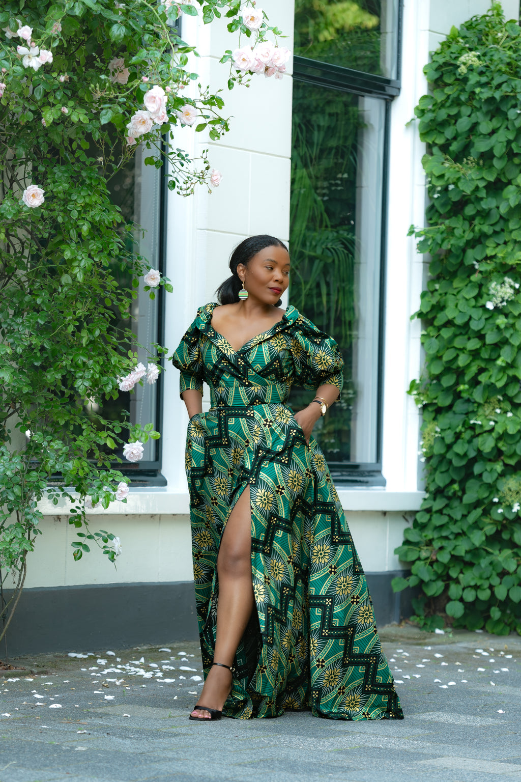 Front view Green and Gold African print Cotton Maxi Dress with puff sleeves and front slit.