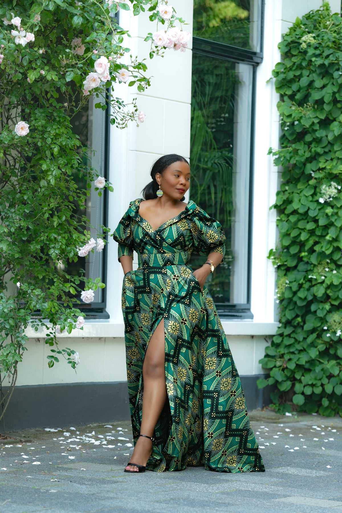 Front view Green and Gold African print Cotton Maxi Dress with puff sleeves and front slit.
