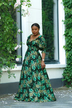 Side View Green and Gold African print Cotton Maxi Dress with puff sleeves.