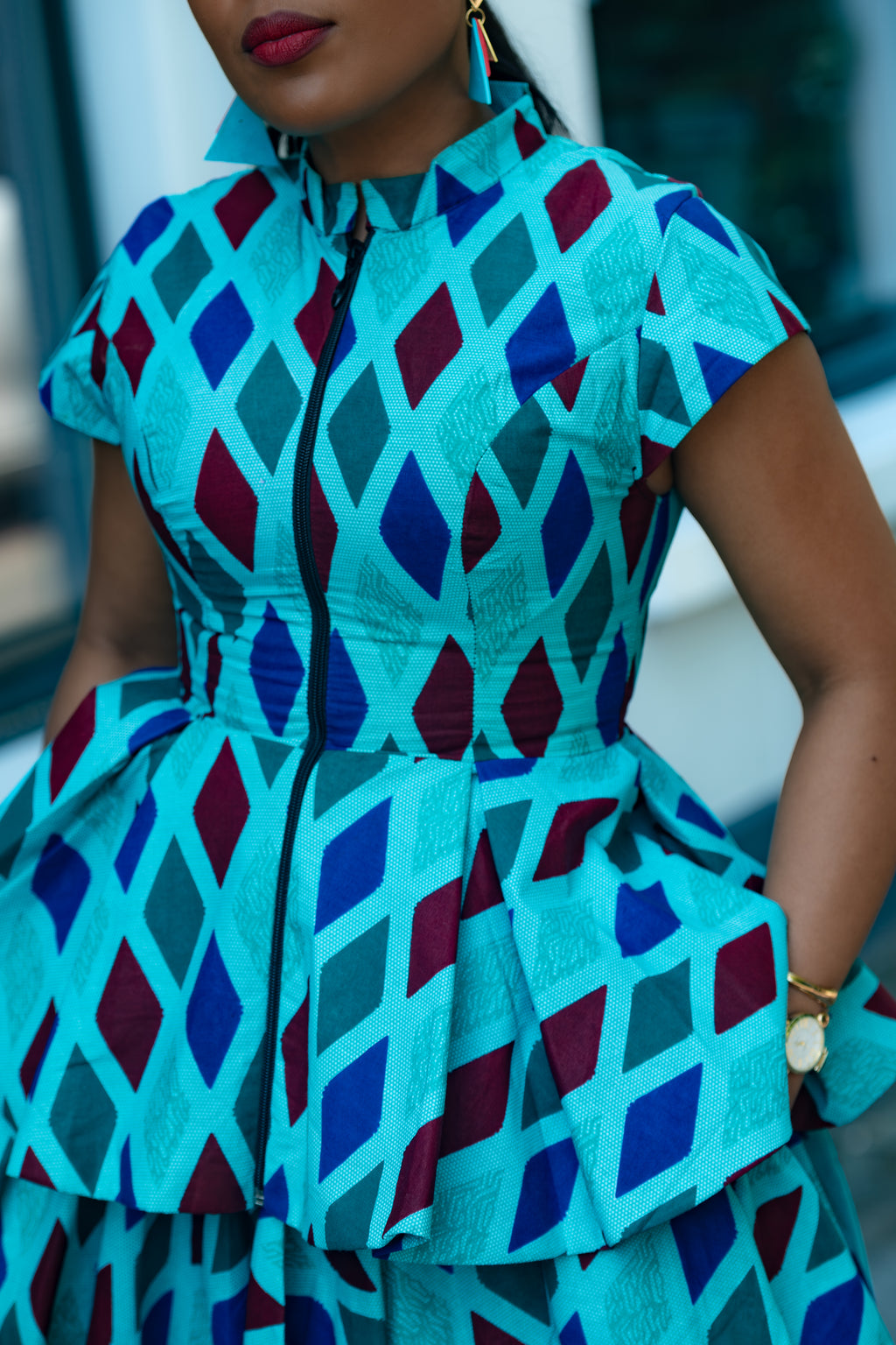 Close up detail of Blue African print Cotton Peplum Top with Front Zipper and matching Skirt.