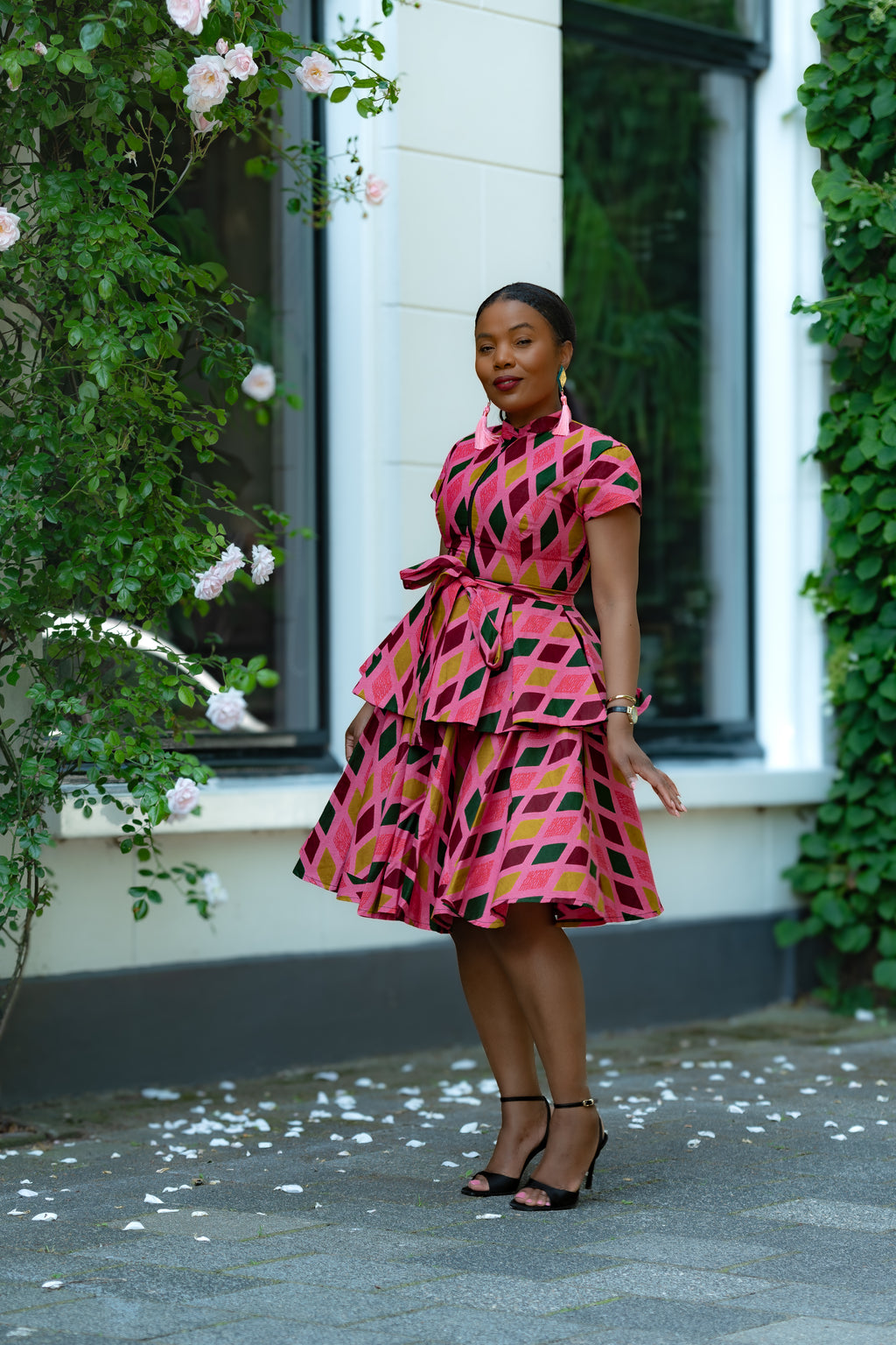Pink African print Cotton Peplum Top with Front Zipper, waist Tie and matching Skirt.