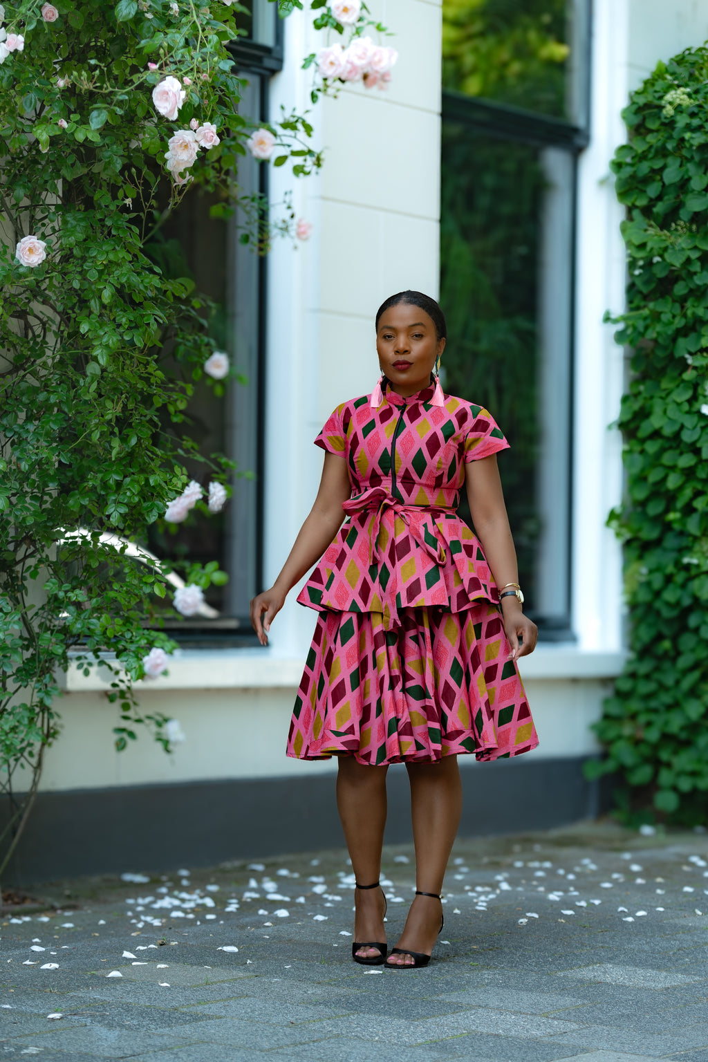 Pink African print Cotton Peplum Top with Front Zipper, waist Tie and matching Skirt.