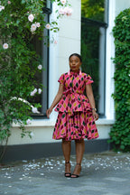 Pink African print Cotton Peplum Top with Front Zipper, waist Tie and matching Skirt.