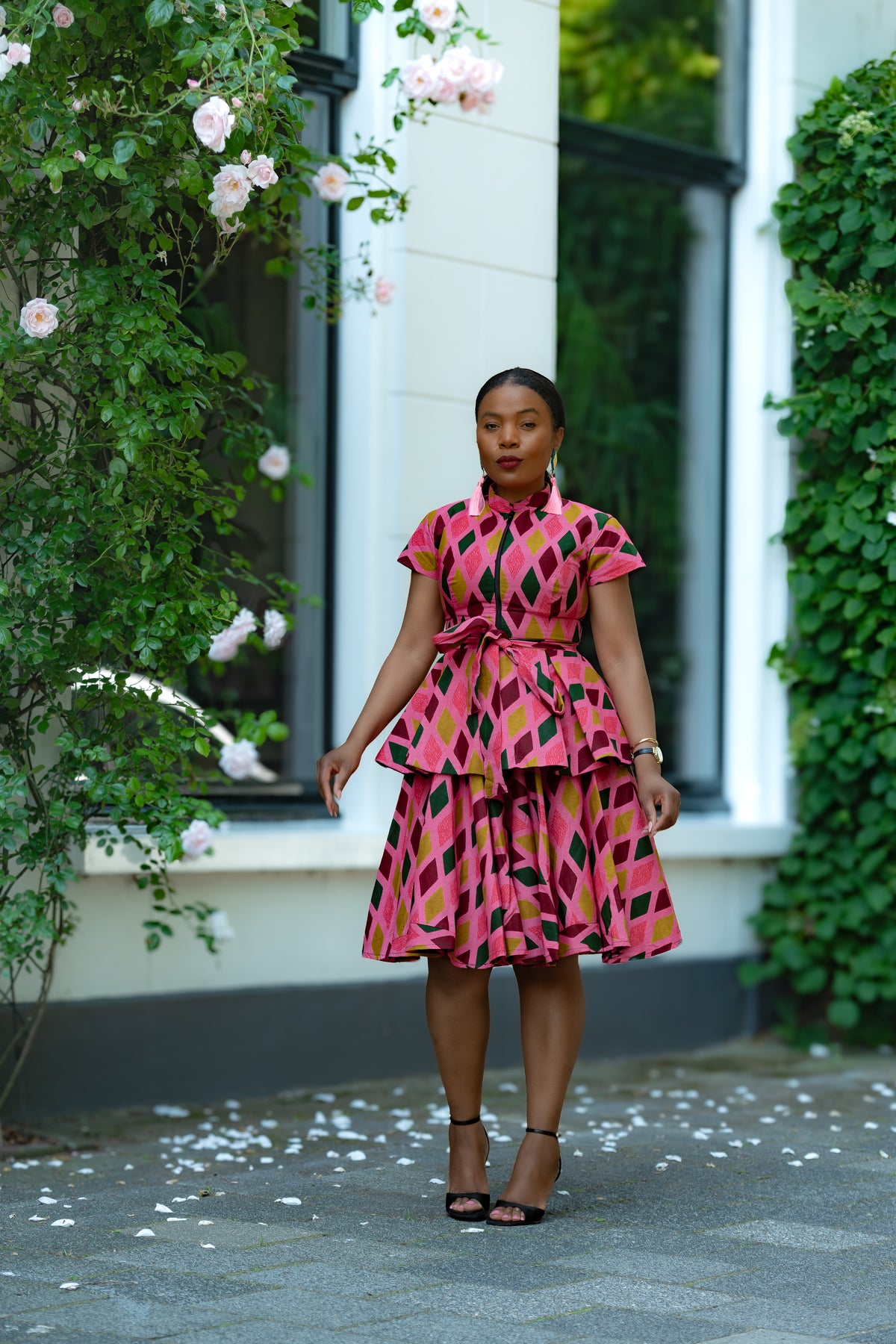 Pink African print Cotton Peplum Top with Front Zipper, waist Tie and matching Skirt.