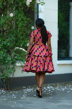 Back detail of Pink African print Cotton Peplum Top with Front Zipper, waist Tie and matching Skirt.