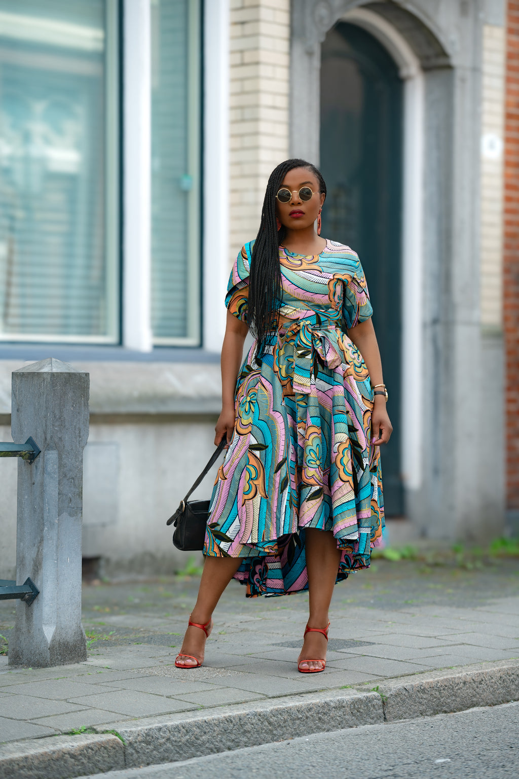 Multicolour African print cotton Midi Dress with Matching Belt styled by Model for an Ocassion.
