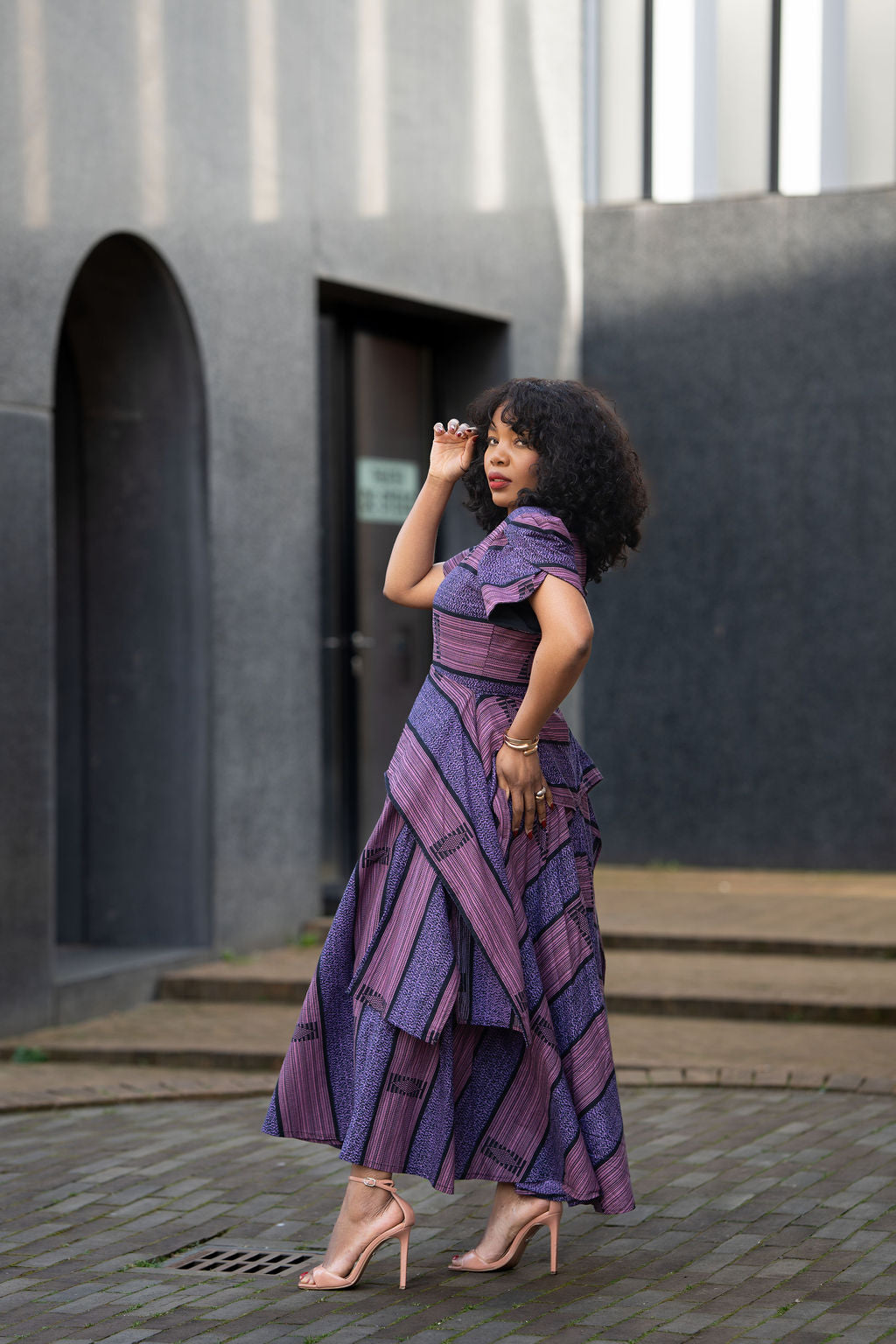 Side view of African print Ankara maxi dress in Deep purple & Lilac